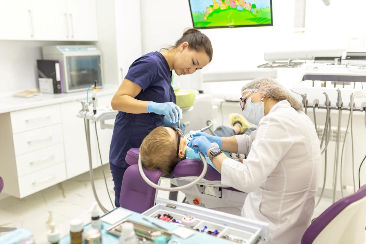 An image of a child receiving dental care for a post titled: When do Kids Need General Anesthesia for Dental Treatment?